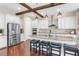 A modern kitchen features stainless steel appliances, granite countertops, and wood floors at 13116 Bliss Loop, Bradenton, FL 34211