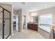 Bathroom featuring a walk-in shower, garden tub, dual vanities, and access to the bedroom at 13116 Bliss Loop, Bradenton, FL 34211