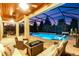 Stunning screened-in pool area with a lounge chair, an outdoor seating area, and lush landscaping at 13116 Bliss Loop, Bradenton, FL 34211