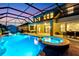 Gorgeous screened-in pool area with a hot tub, patio, and seating, perfect for outdoor entertaining at 13116 Bliss Loop, Bradenton, FL 34211