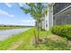 Well-maintained backyard near a serene pond, complemented by lush green grass at 14184 Heritage Landing Blvd # 513, Punta Gorda, FL 33955