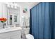 Neat bathroom with a single sink, blue shower curtain, and essential fixtures at 14184 Heritage Landing Blvd # 513, Punta Gorda, FL 33955