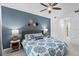 Bright bedroom with a ceiling fan, decor, and coordinated blue bedding at 14184 Heritage Landing Blvd # 513, Punta Gorda, FL 33955