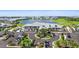 Community clubhouse featuring beautiful lake views, lush landscaping, ample parking, and sidewalks at 14184 Heritage Landing Blvd # 513, Punta Gorda, FL 33955