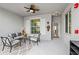 Screened lanai with stylish seating area, overhead fan, and access to the interior at 14184 Heritage Landing Blvd # 513, Punta Gorda, FL 33955