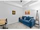 Cozy bonus room with a sofa, desk, and overhead lighting for both leisure and productive activities at 14184 Heritage Landing Blvd # 513, Punta Gorda, FL 33955
