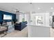 Bright open concept with living room, kitchen featuring white quartz counters and stainless steel refrigerator at 14184 Heritage Landing Blvd # 513, Punta Gorda, FL 33955