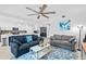 Spacious living room with open layout, neutral tones, comfortable furniture, and a ceiling fan for optimal comfort at 14184 Heritage Landing Blvd # 513, Punta Gorda, FL 33955
