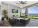 Outdoor patio featuring comfortable seating, a modern fireplace, and beautiful views at 14184 Heritage Landing Blvd # 513, Punta Gorda, FL 33955