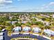 A peaceful aerial view showcasing lush greenery, serene water features, and convenient parking at 14519 Catalina Cir, Seminole, FL 33776