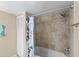 Bathroom featuring tiled shower with shower curtain and a white closet door at 14519 Catalina Cir, Seminole, FL 33776