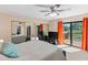 Bedroom featuring large glass doors to a wooden porch, with a water view at 14519 Catalina Cir, Seminole, FL 33776