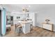 Bright kitchen with granite countertops, stainless steel appliances, and a stylish island with seating at 14519 Catalina Cir, Seminole, FL 33776