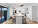 Well-lit kitchen featuring a granite island, stainless steel appliances, and a sliding glass door to the outside at 14519 Catalina Cir, Seminole, FL 33776