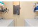 Laundry room with washer, dryer, shelving, and an electrical panel on the wall at 14519 Catalina Cir, Seminole, FL 33776