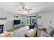 Bright living room with sliding glass doors and modern flooring at 14519 Catalina Cir, Seminole, FL 33776