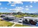 Abundant covered parking available with beautiful water views, tennis court, and manicured landscaping at 14519 Catalina Cir, Seminole, FL 33776