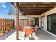 Relaxing outdoor patio with table, chairs, privacy fence, and convenient access to the interior at 14519 Catalina Cir, Seminole, FL 33776