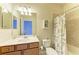 Bathroom showcasing vanity with drawers, mirror, and a bathtub with shower at 157 Wandering Wetlands Cir, Bradenton, FL 34212
