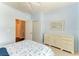 Coastal style bedroom with blue walls, white trim, and a view into the hallway at 157 Wandering Wetlands Cir, Bradenton, FL 34212