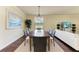Formal dining room with seating for six, wooden table, modern chandelier, and neutral decor at 157 Wandering Wetlands Cir, Bradenton, FL 34212