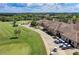 Beautiful aerial view of the golf course, putting green, and clubhouse on a sunny day at 157 Wandering Wetlands Cir, Bradenton, FL 34212