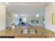 Kitchen with granite countertops overlooking dining and living areas at 157 Wandering Wetlands Cir, Bradenton, FL 34212