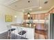 Well-appointed kitchen with granite countertops, stainless steel appliances, and a convenient breakfast bar at 157 Wandering Wetlands Cir, Bradenton, FL 34212