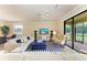 Bright and airy living space featuring a modern design, comfortable sofas, and a view to the outdoor patio at 157 Wandering Wetlands Cir, Bradenton, FL 34212