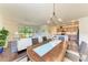 Open-concept living space combines the living room and dining area for modern living and entertaining at 157 Wandering Wetlands Cir, Bradenton, FL 34212