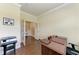 Bright office space featuring hardwood floors, crown molding, and a view into another room at 157 Wandering Wetlands Cir, Bradenton, FL 34212