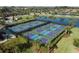 Aerial view of active pickleball courts, perfect for a fun and social lifestyle at 157 Wandering Wetlands Cir, Bradenton, FL 34212