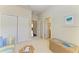 Comfortable sitting room with neutral tones and a view towards multiple hallways and closets at 157 Wandering Wetlands Cir, Bradenton, FL 34212