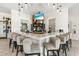 Modern bar area with marble counters, comfortable seating, and a wide selection of beverages at 17576 Holly Well Ave, Wimauma, FL 33598
