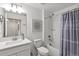 Cozy bathroom featuring a shower and tub combination with a white subway tile surround at 17576 Holly Well Ave, Wimauma, FL 33598