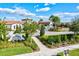 Welcoming entrance to Medley at Southshore Bay community with lush landscaping and signage at 17576 Holly Well Ave, Wimauma, FL 33598
