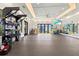 Well-equipped gym featuring modern exercise equipment, ample space, and a view of the outdoors at 17576 Holly Well Ave, Wimauma, FL 33598