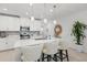 Bright and airy kitchen featuring a large island, modern appliances, and stylish finishes at 17576 Holly Well Ave, Wimauma, FL 33598