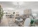 Bright and open living area showcasing elegant decor, a spacious layout, and modern furnishings at 17576 Holly Well Ave, Wimauma, FL 33598