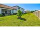 Expansive backyard offers ample space and privacy, ideal for outdoor activities and recreation at 17578 Holly Well Ave, Wimauma, FL 33598