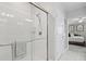 Modern bathroom with a glass shower, silver hardware, and neutral tones at 17578 Holly Well Ave, Wimauma, FL 33598
