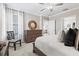 Spacious bedroom with a dresser and soft lighting, perfect for relaxation at 17578 Holly Well Ave, Wimauma, FL 33598
