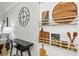 Decor in kitchen featuring a wall clock, cutting boards, small console table and lamp at 17578 Holly Well Ave, Wimauma, FL 33598