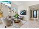 Comfortable lounge area with contemporary furnishings and stylish decor for relaxation and socializing at 17578 Holly Well Ave, Wimauma, FL 33598