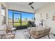 Inviting screened patio with cozy furniture and view of the backyard at 17578 Holly Well Ave, Wimauma, FL 33598