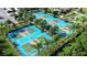 Aerial view of a community featuring several well-maintained pickleball courts surrounded by trees at 17578 Holly Well Ave, Wimauma, FL 33598