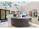Stylish reception desk area in the clubhouse featuring modern design and inviting atmosphere at 17578 Holly Well Ave, Wimauma, FL 33598