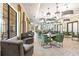 Inviting seating area with plush chairs and tables, perfect for casual gatherings and events at 17578 Holly Well Ave, Wimauma, FL 33598