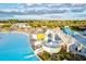 A clear shot of community waterslides with yellow and white color schemes, offering a dynamic recreation experience at 17578 Holly Well Ave, Wimauma, FL 33598