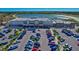 Aerial view of the Publix Super Market and retail shops with a parking lot and a scenic pond in the background at 17732 Wayside Bnd, Punta Gorda, FL 33982